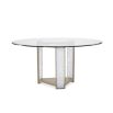 Glamorous round dining table with a glass top and divine crystal-like legs and brass accents