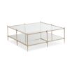A glamorous, square coffee table by Caracole with a patterned surface