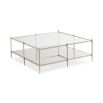 A glamorous, square coffee table by Caracole with a patterned surface