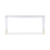 A contemporary console table crafted from clear acrylic with gold capped feet