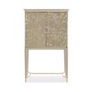 A luxury bar cabinet with leaf motif embellishments and a champagne finish