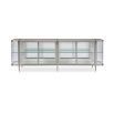 A contemporary console table by Caracole with clear, wave-effect acrylic doors and a mirrored interior