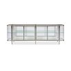 A contemporary console table by Caracole with clear, wave-effect acrylic doors and a mirrored interior