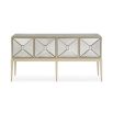 A dazzling sideboard by Caracole with mirrored glass doors and a glamorous gold finish