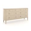 A sophisticated dresser by Caracole with a cream finish, acrylic handles and seven spacious drawers