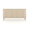 A sophisticated dresser by Caracole with a cream finish, acrylic handles and seven spacious drawers