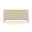 A sophisticated dresser by Caracole with a cream finish, acrylic handles and seven spacious drawers