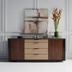 A luxury dresser by Caracole with a rich walnut finish and gold hardware