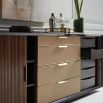 A luxury dresser by Caracole with a rich walnut finish and gold hardware