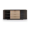 A luxury dresser by Caracole with a rich walnut finish and gold hardware