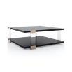 Bold square black coffee table with acrylic legs and brass accents 