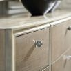 Nine-draw natural dresser with chrome metal ferrules