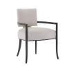 A contemporary dining chair by Caracole with a curved frame, grey upholstery and gold panel