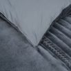 A luxurious navy velvet bedspread with handstitched details