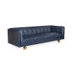 A luxurious modern sofa with navy leather upholstery and brass feet 