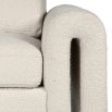 Luxurious sofa with modern curve armrests and boucle finsih