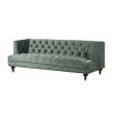 Luxurious sage green velvet buttoned sofa
