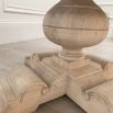 Elegant round dining table with washed wood finish