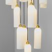 A luxurious chandelier by Schwung with translucent opal glass lampshades and a solid brass structure