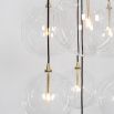 Glamorous industrial chandelier with multiple hanging clear glass globe lampshades