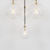 Glamorous industrial chandelier with multiple hanging clear glass globe lampshades
