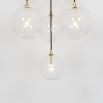 Glamorous industrial chandelier with multiple hanging clear glass globe lampshades