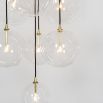 Glamorous industrial chandelier with multiple hanging clear glass globe lampshades