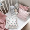 A breathtakingly beautiful children's cushion with a green and pink pattern finished with fringing 