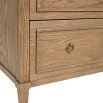 A stylish minimalist oak and plywood three drawer chest of drawers with brass handles