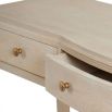 A luxurious whitewash oak console table with brass detailing