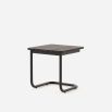 A luxurious brown laminate and painted steel side table 