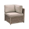 A luxury rattan outdoor garden set featuring a modular corner sofa, armchair, stool and coffee table