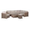 A luxury rattan outdoor garden set featuring a modular corner sofa, armchair, stool and coffee table