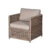 A luxury rattan outdoor garden set featuring a modular corner sofa, armchair, stool and coffee table