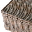 A luxury rattan outdoor garden set featuring a modular corner sofa, armchair, stool and coffee table