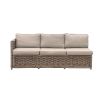 A luxury rattan outdoor garden set featuring a modular corner sofa, armchair, stool and coffee table