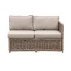 A luxury rattan outdoor garden set featuring a modular corner sofa, armchair, stool and coffee table