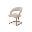 Sleek dining chair with bronze finish base and luxuriously sumptuous seat