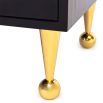 A luxurious, contemporary cabinet with glossy black lacquer and acrylic and brass accents 