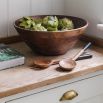Long rich wooden salad serves with black detailing 