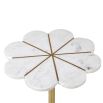A glamourous floral inspired side table with a white marble flower shaped top and a brushed brass base