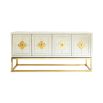 An elegant antiqued glass and polished brass maximalist credenza