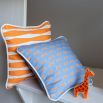 A colourful children's cushion with a playful pattern 