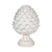 decadent artichoke-shaped decorative object on ornate pedestal