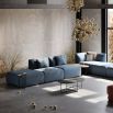 Luxury, large sofa upholstered in a beautiful blue fabric, with curvy, contemporary design