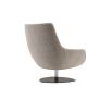 A luxurious armchair by Domkapa with a polished base