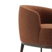 A luxurious round, boucle retro-inspired armchair 