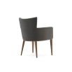 A chic modern mid-century modern dining armchair with wooden legs