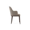 A sophisticated and stylish chair by Domkapa with a luxury upholstery and dark wooden frame