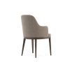 A sophisticated and stylish chair by Domkapa with a luxury upholstery and dark wooden frame